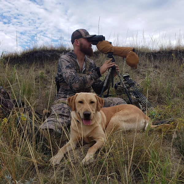 Badass bearded man and dog scouting